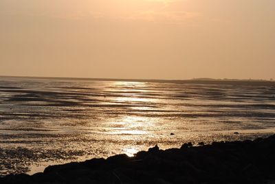 Scenic view of sea at sunset