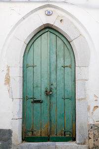 Old green door of old building