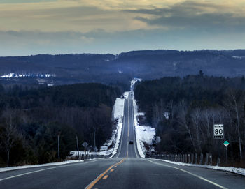 Empty road against sky