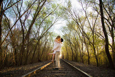 Side view of woman walking on road