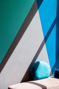 High angle view of sunlight falling on blue table