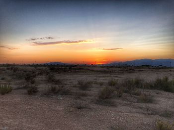 Scenic view of landscape at sunset