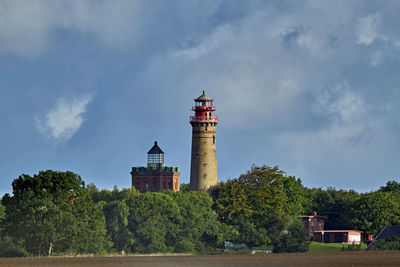 Lighthouse on building against sky