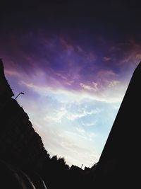 Low angle view of building against cloudy sky