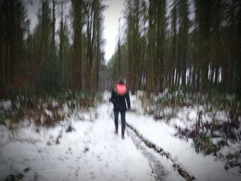 People standing on snow covered landscape