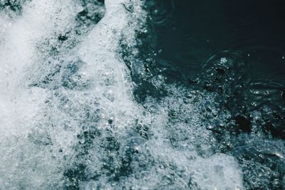 High angle view of water flowing over sea