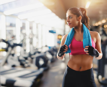 Young woman exercising in gym