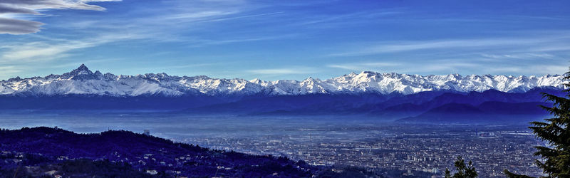 Scenic view of snowcapped mountains against sky