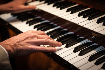 Cropped image of man playing piano