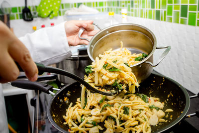 High angle view of woman preparing food on table