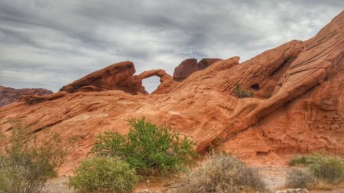 Rock formations on landscape against sky