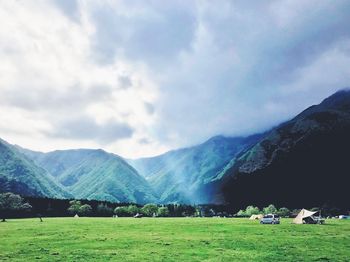 Scenic view of landscape and mountains against sky