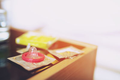 Close-up of condom on table