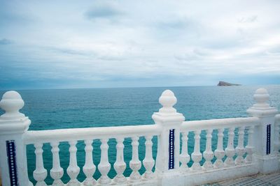 Close-up of railing against sea