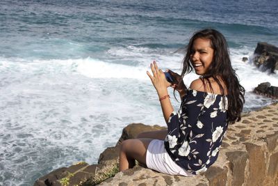 Woman sitting at beach