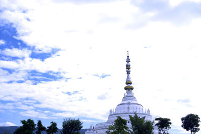 Low angle view of building against cloudy sky