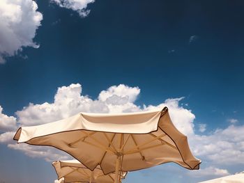 Low angle view of parasol against sky