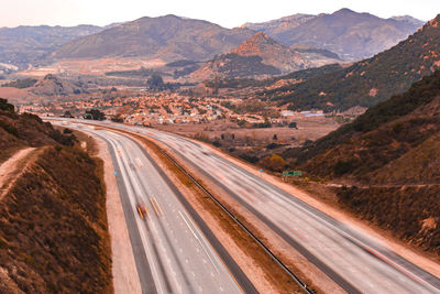 High angle view of road leading towards mountains