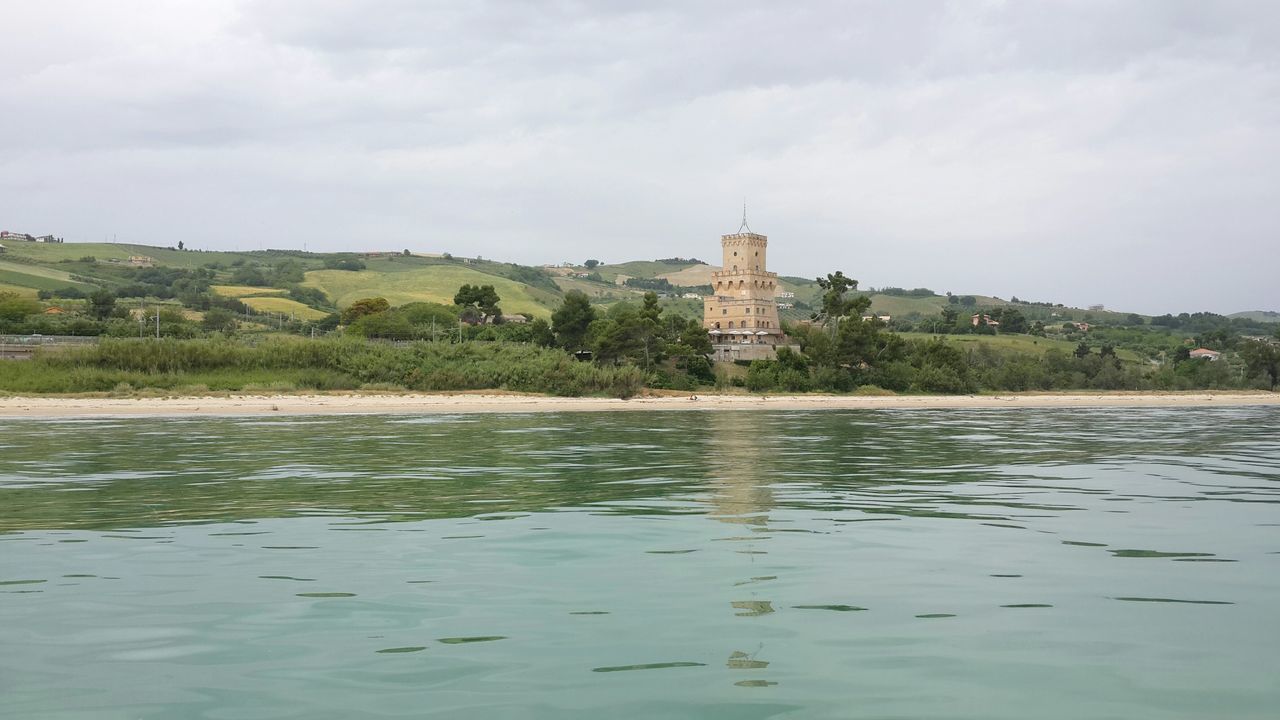 architecture, water, built structure, sky, building exterior, cloud - sky, waterfront, tree, lake, river, cloud, nature, cloudy, tranquility, day, castle, reflection, tranquil scene, history, scenics