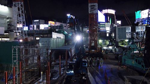 Vehicles on illuminated city at night