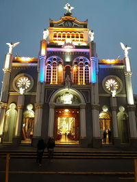 Low angle view of illuminated building at night