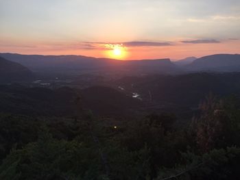 Scenic view of mountains against sky during sunset