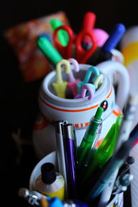 High angle view of colored pencils in container