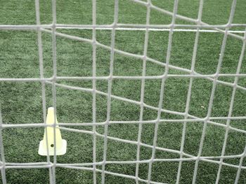 Soccer training. soccer slalom drills. marker cones are soccer training equipment on artificial turf