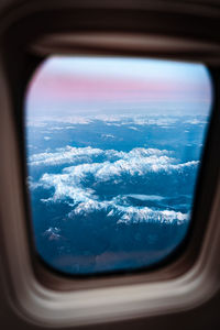 Aerial view of clouds seen from airplane window
