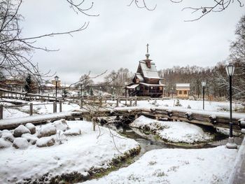 Snow covered temple against sky