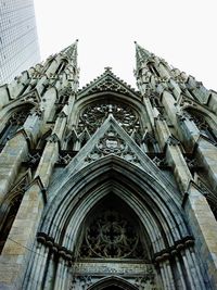 Low angle view of bell tower against sky