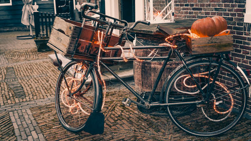 Bicycle with lighting equipment parked on footpath
