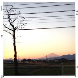 Scenic view of mountains against sky at sunset