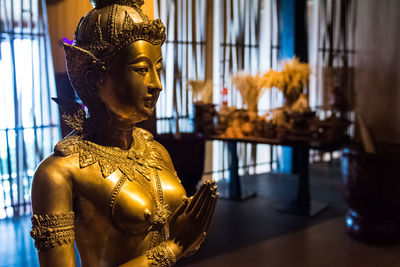 Close-up of buddha statue in building