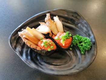 High angle view of fish in bowl on table