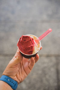 Cropped hand holding ice cream