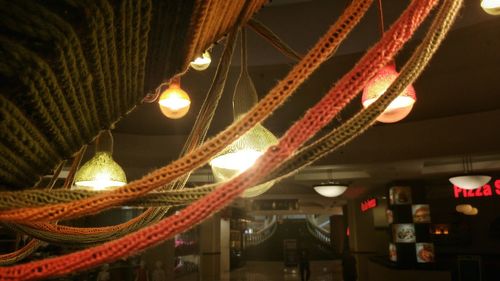 Low angle view of illuminated lights at night