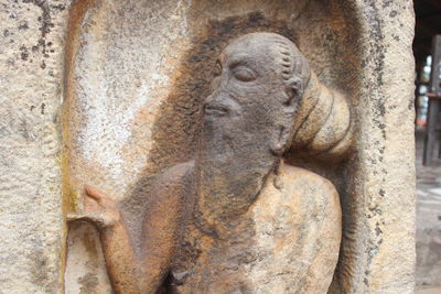 Close-up of statue against wall