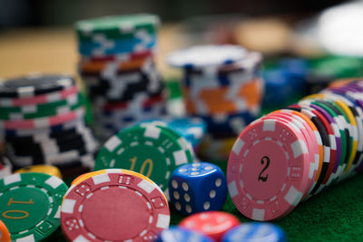 Close-up of colorful gambling chips on table