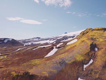 Scenic view of snowcapped mountains against sky