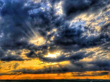 Low angle view of dramatic sky during sunset