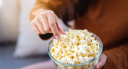 Midsection of woman holding food