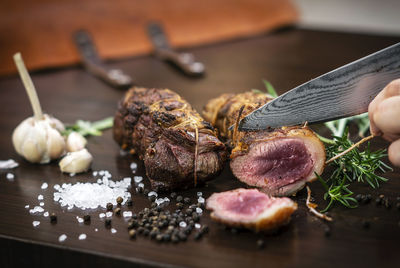 Close-up of person preparing food on cutting board