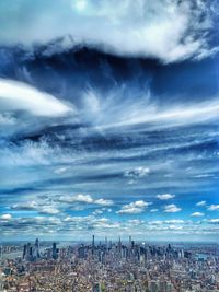 High angle view of city against cloudy sky