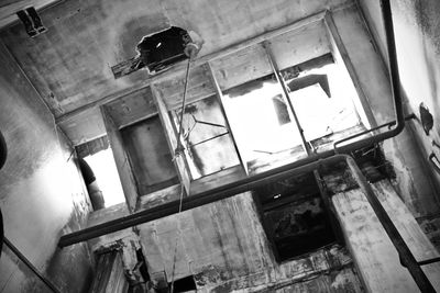 Low angle view of window in abandoned building