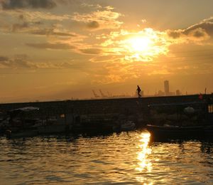 Boat in river at sunset