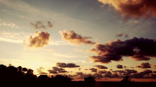 Silhouette of building at sunset