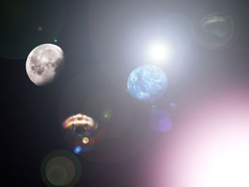 Close-up of bubbles against moon