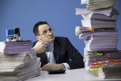 Rear view of man working on table