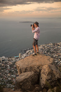 Full length of man standing on rock